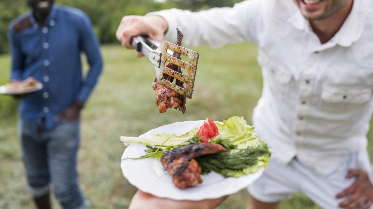 men-cooking-barbecue-outdoors